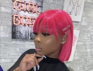 Person wearing a pink bob wig at a special occasion