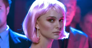 Person wearing a pink bob wig at a party