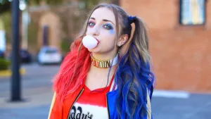 Harley Quinn cosplay with pigtails and color streaks