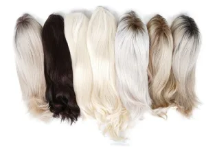 Picture of different types of wig stands lined up for comparison