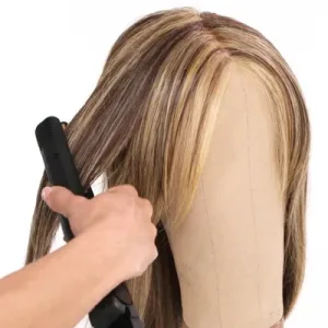 Styling a short wig with a heat tool