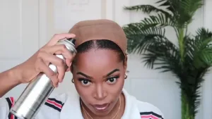 Woman preparing her hair with a wig cap