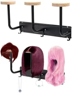 A neatly arranged wig stand with various wigs